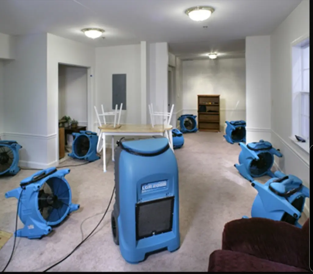 Air movers and dehumidifier setup for Water Damage Restoration in Camden